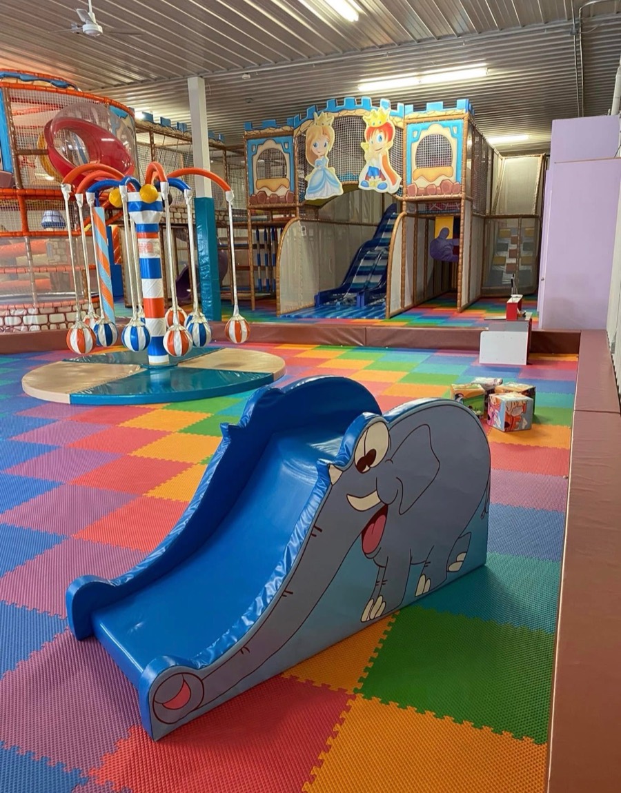 Children playing in the bright, open play area at Kidz Kingdom